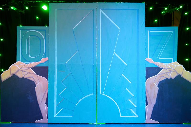 Two flats painted to resemble art-deco style gates