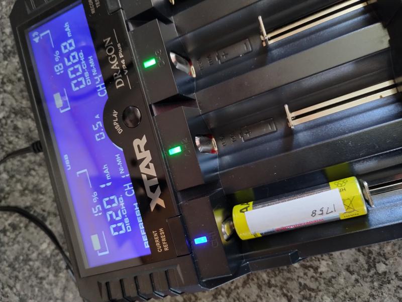 A battery charger with a battery being discharged