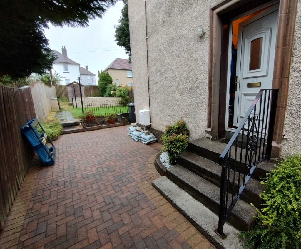 The side of the house with the bed in question visible