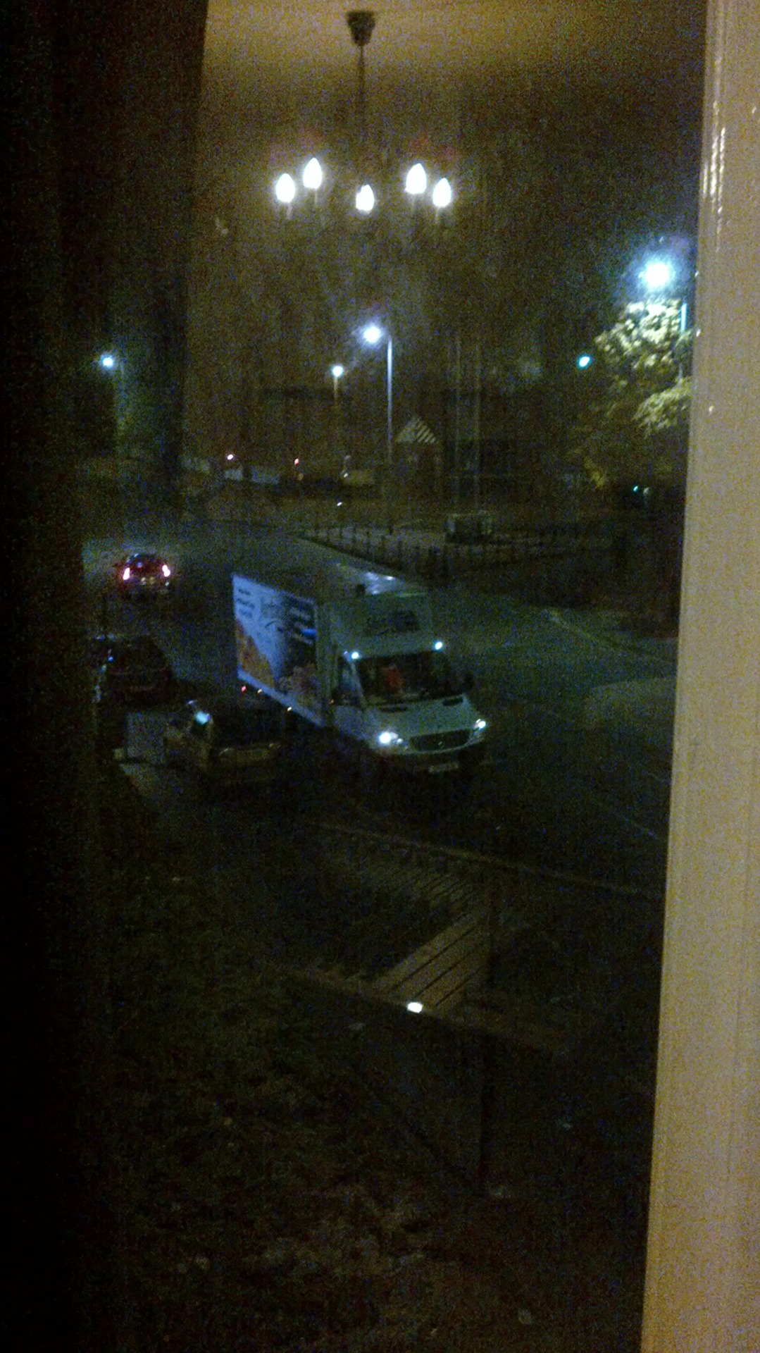 The delivery van that pulled up outside while I was in the living room.